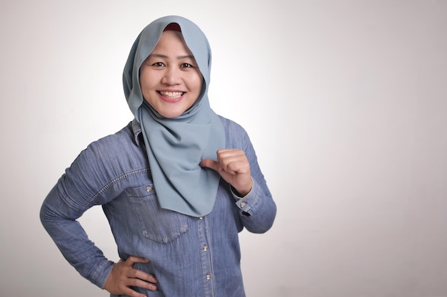 Confident Muslim Lady Smiling and Pointing Herself