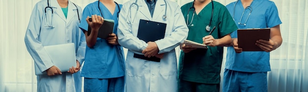 Confident and professional team of medical staff stand in line together Rigid