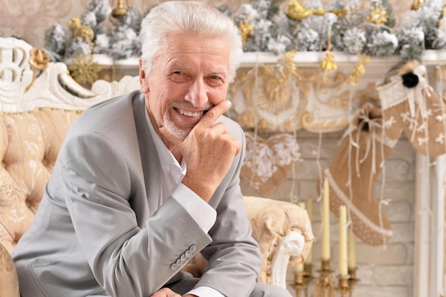 Confident senior businessman sitting in chair