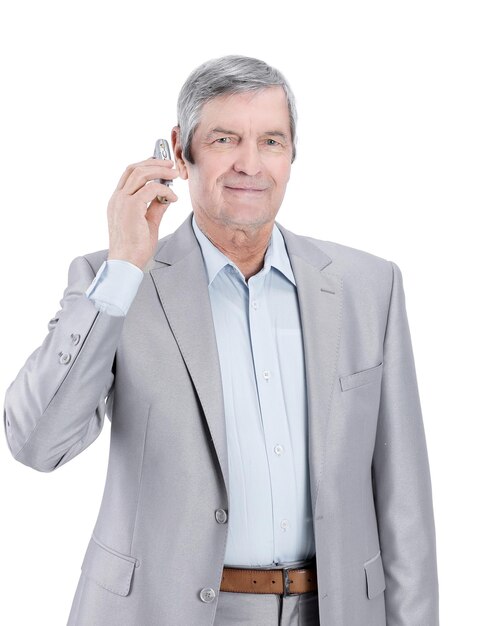 Confident senior businessman with mobile phonei