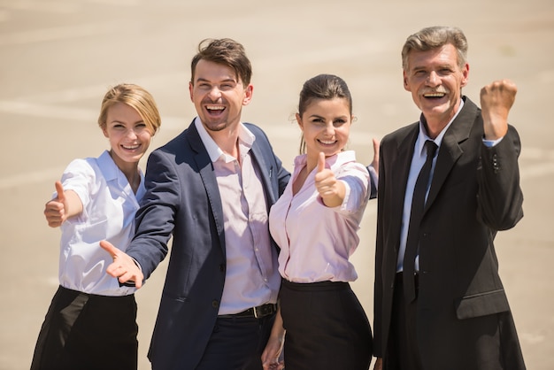 Confident smiling business people enjoying their success.