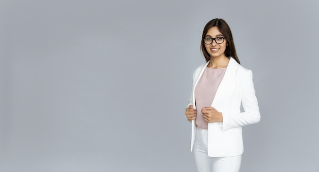 Confident smiling indian businesswoman look at camera isolated on background