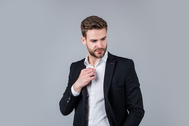 Confident and stylish. bearded man with business look. fashion and beauty. barbershop concept. mens wear. confident businessman. young handsome guy in office suit. stylish male wear formal clothes.