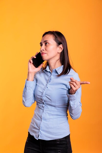 Confident stylish woman talking on telephone line person