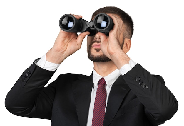 Photo confident and successful. confident young handsome man in shirt and tie with binoculars