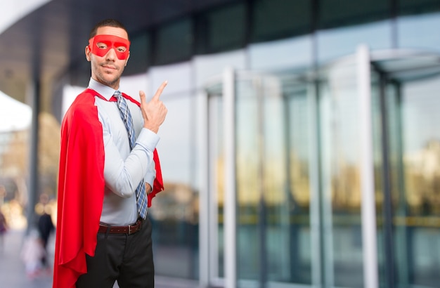 Photo confident super businessman pointing