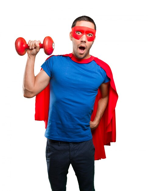 Photo confident superhero with a dumbbell