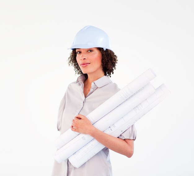 Confident woman holding construction plans