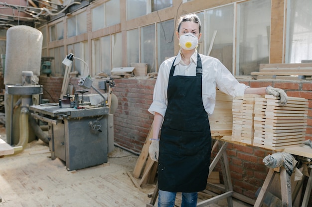 Confident woman working as carpenter