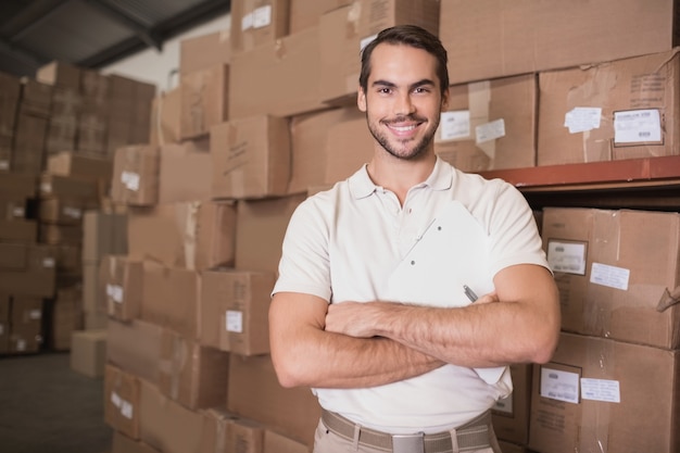 Confident worker smiling in warehouse