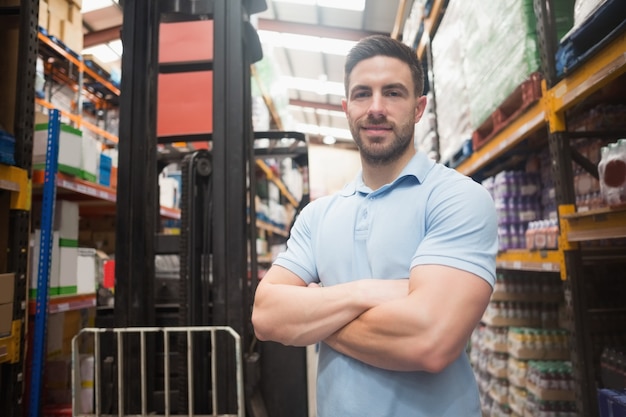 Confident worker smiling in warehouse