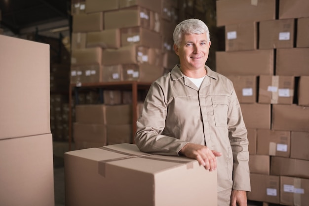 Confident worker smiling in warehouse