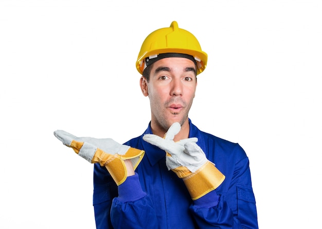 Confident worker with show gesture on white background