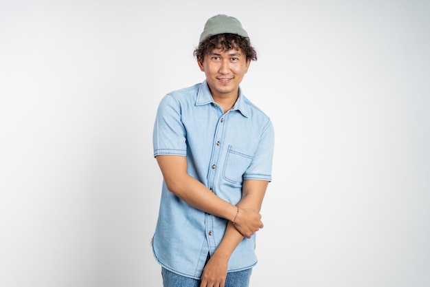 Confident young asian man pose on isolated background