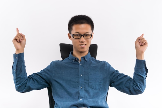 Confident Young business man sitting in a chair