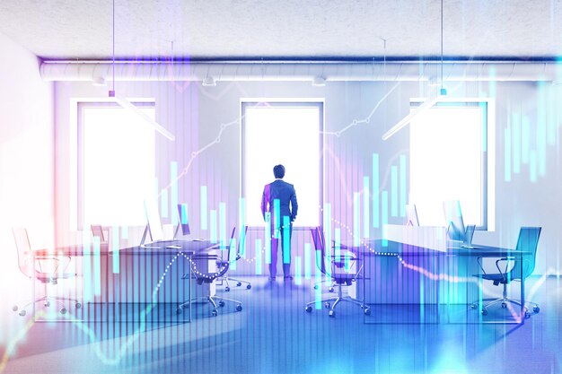 Photo confident young businessman looking in his office window at a city. glowing forex style graphs and bar charts immersive interface. concept of finance success. toned image double exposure mock up