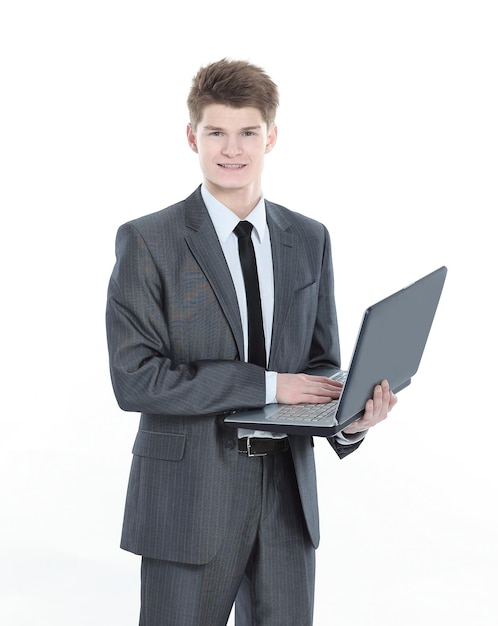 Confident young businessman with a laptop isolated on a white