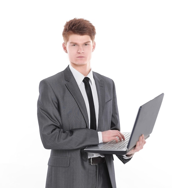 Confident young businessman with a laptop isolated on a white