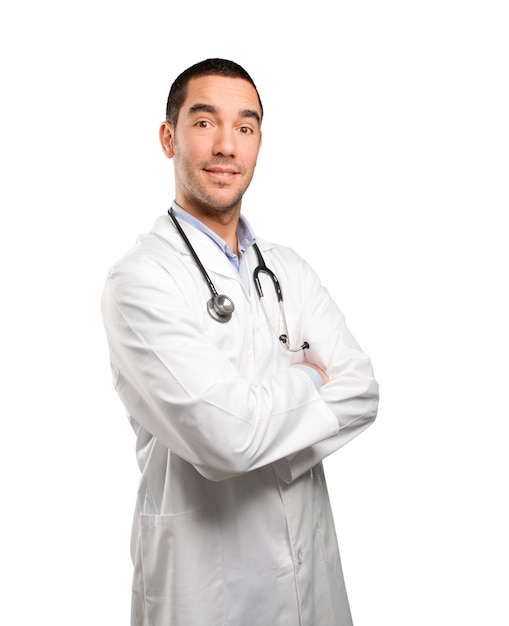 Confident young doctor posing