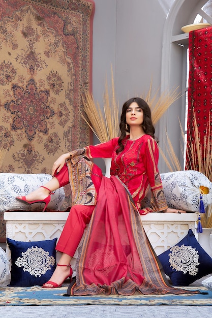 Confident Young Girl Sitting on Table with Attitude Wearing Desi Dress for Fashion Photoshoot
