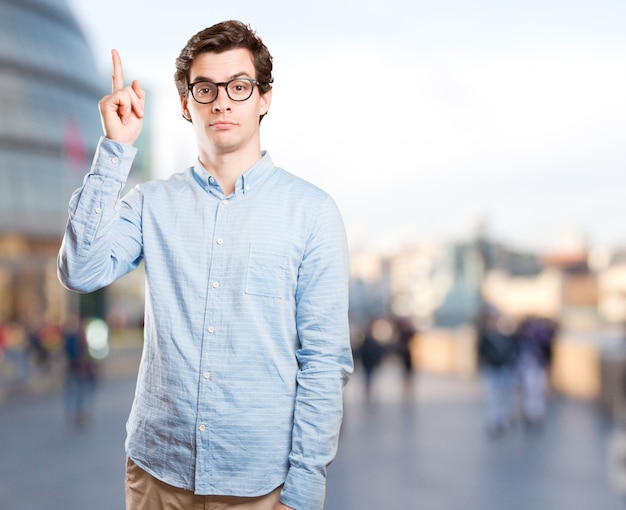 Confident young man pointing