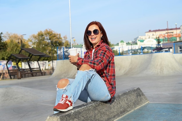 a confident young woman walks through the streets of the city a woman smiles and enjoys life