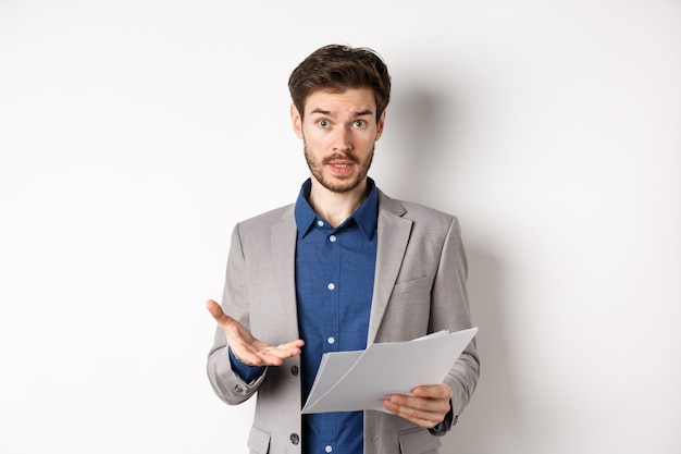 Confused businessman looking at bad document