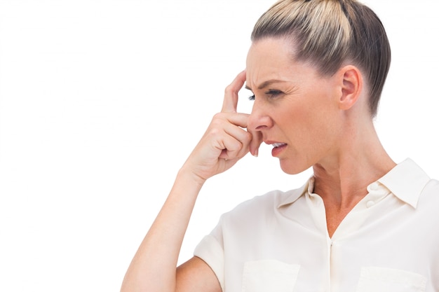 Confused businesswoman with hand on forehead