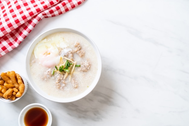 congee with minced pork in bowl 