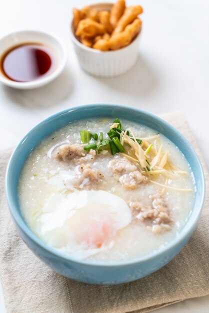 congee with minced pork in bowl 