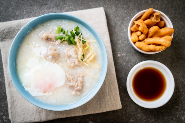 congee with minced pork in bowl 