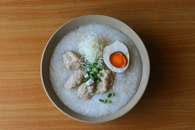 Congee with salted egg and meatball