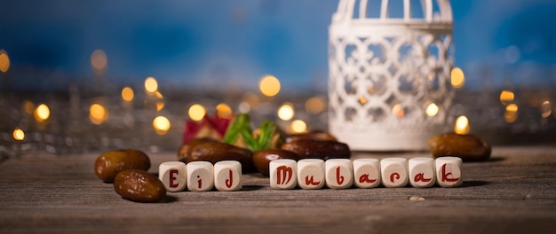 Congratulation EID MUBARAK composed of wooden dices Closeup