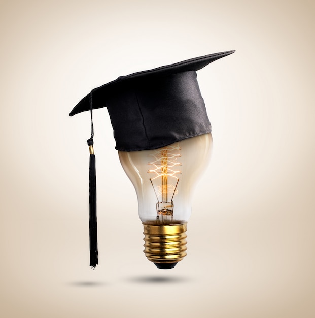 Photo congratulations graduates cap on a lamp bulb,  of education.