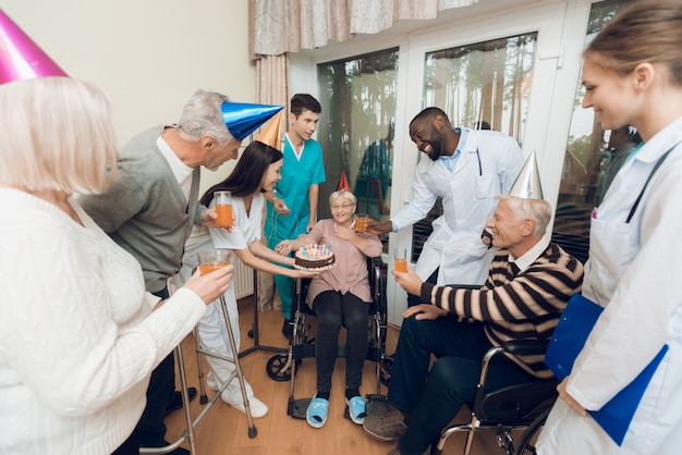 Congratulations for old woman is very surprised and happy.