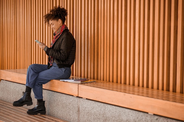 Connected. A pretty dark-skinned girl with a phone