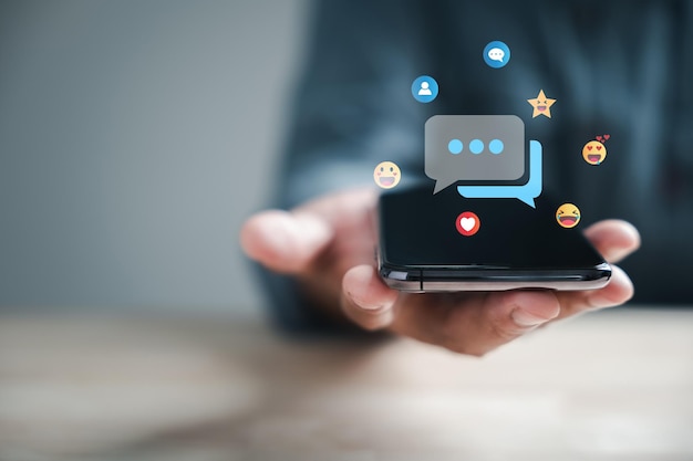 Connected through technology man on phone chats live discussing social network concepts Chat box icons appear representing digital communication trends