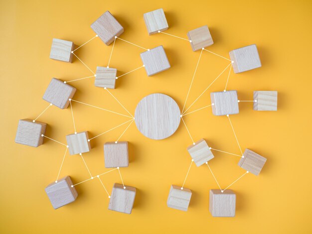 Connected wooden blocks on a yellow background