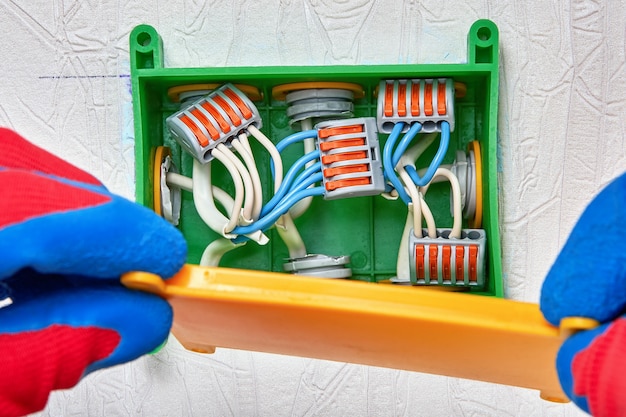 Connecting electrical wires with clamp connector.