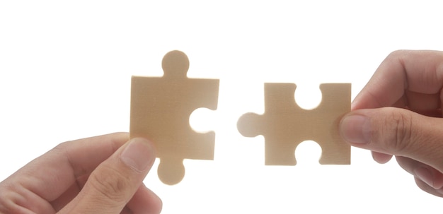 Collegamento del puzzle in mano successo delle soluzioni aziendali e concetto di strategia