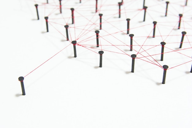 The connection between the two networks. simulation linked together with red thread with copy space