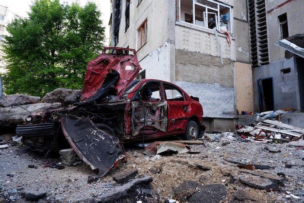 Consequences of the war in Ukraine destroyed houses and burned cars