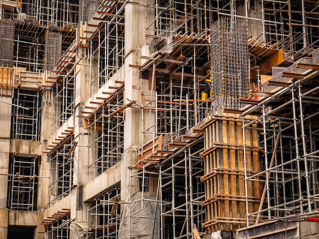 The construction of the building is still in progress with lots of iron structures