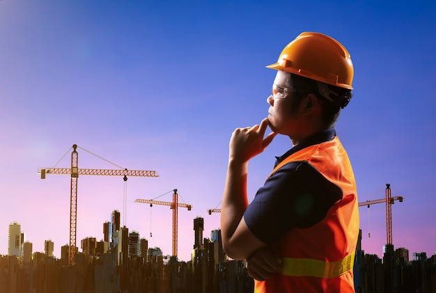 Construction business with civil engineer and construction site