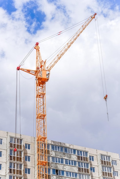 Construction crane on a building area and a blue sky backgroung.