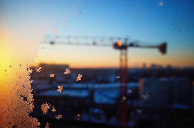 Construction crane through winter window