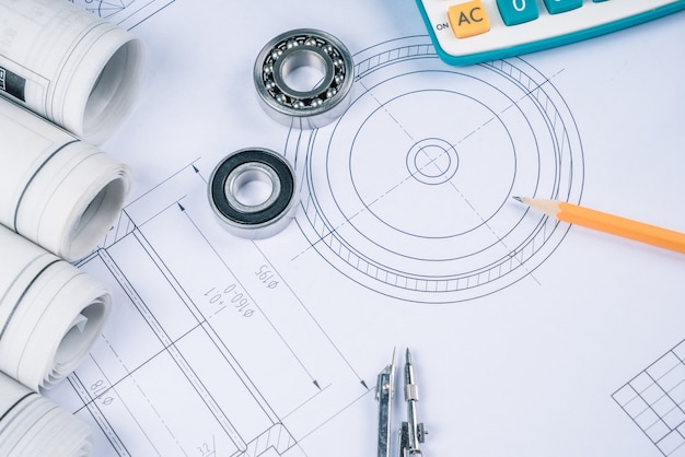 Construction drawings slide caliper roller bearings on blueprint architecture and building concept.