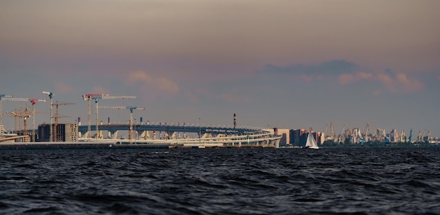 The under construction on the embankment of the neva river on vasilievsky island in sunset highway