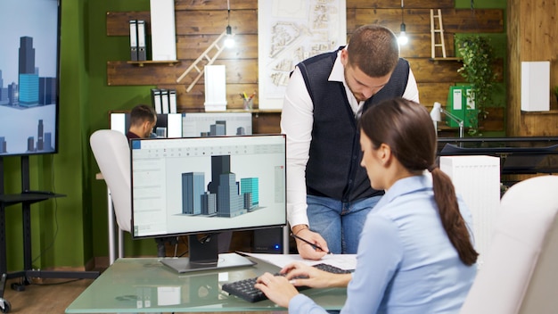 Photo construction engineer and female architect having a discussion about new office buildings. architect holding building models.