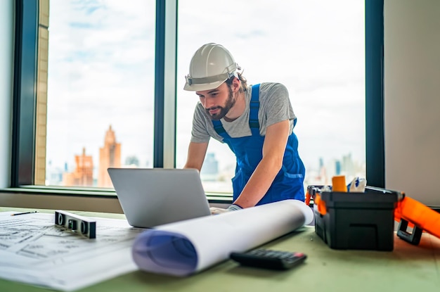 Construction engineer or foreman worker checking construction site